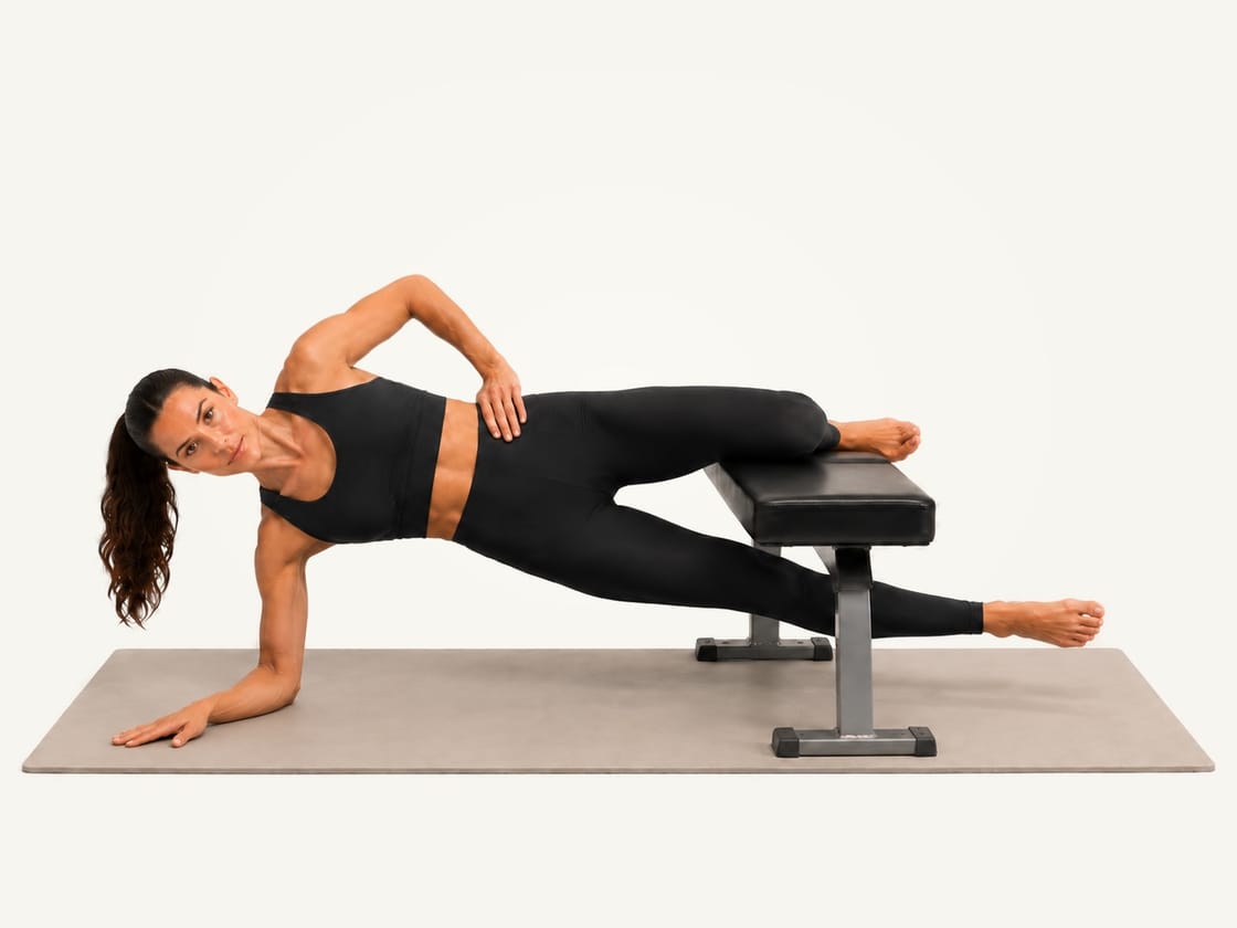 Copenhagen plank: side plank on the right forearm with the bent left knee on a bench and the lower foot lifted