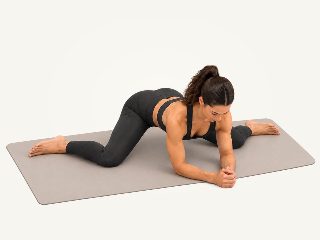 Frog stretch: knees wide, feet turned out, resting on both forearms with the hips eased back
