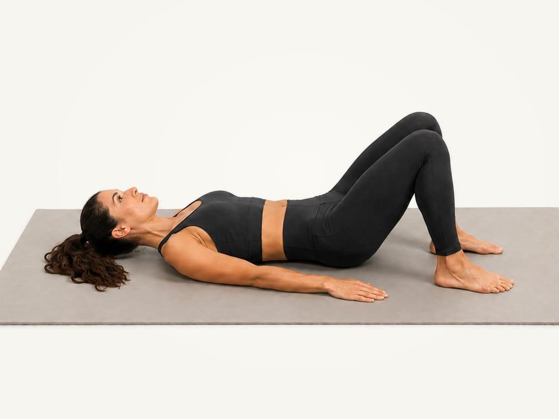 Step 1 of the glute bridge: lying on the back, knees bent, feet flat and hip-width apart, arms by the sides