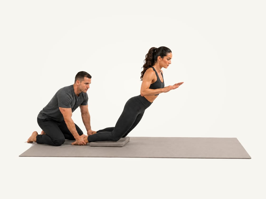 Nordic curl: leaning forward from the knees with a straight body while a partner holds both ankles