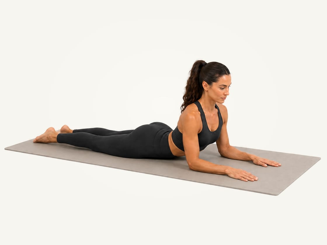 Sphinx pose: lying face down with the chest lifted onto the forearms, elbows under the shoulders