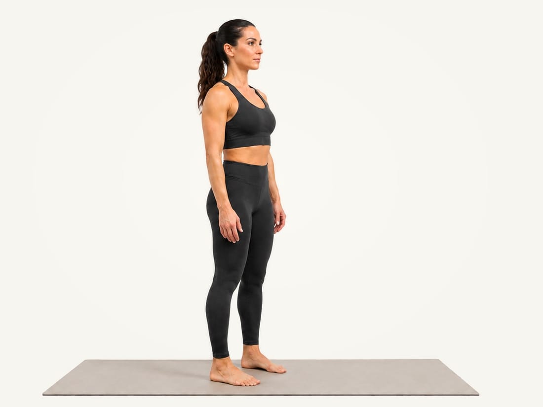 Step 1 of the standing hamstring stretch: standing tall, feet hip-width apart, knees slightly bent