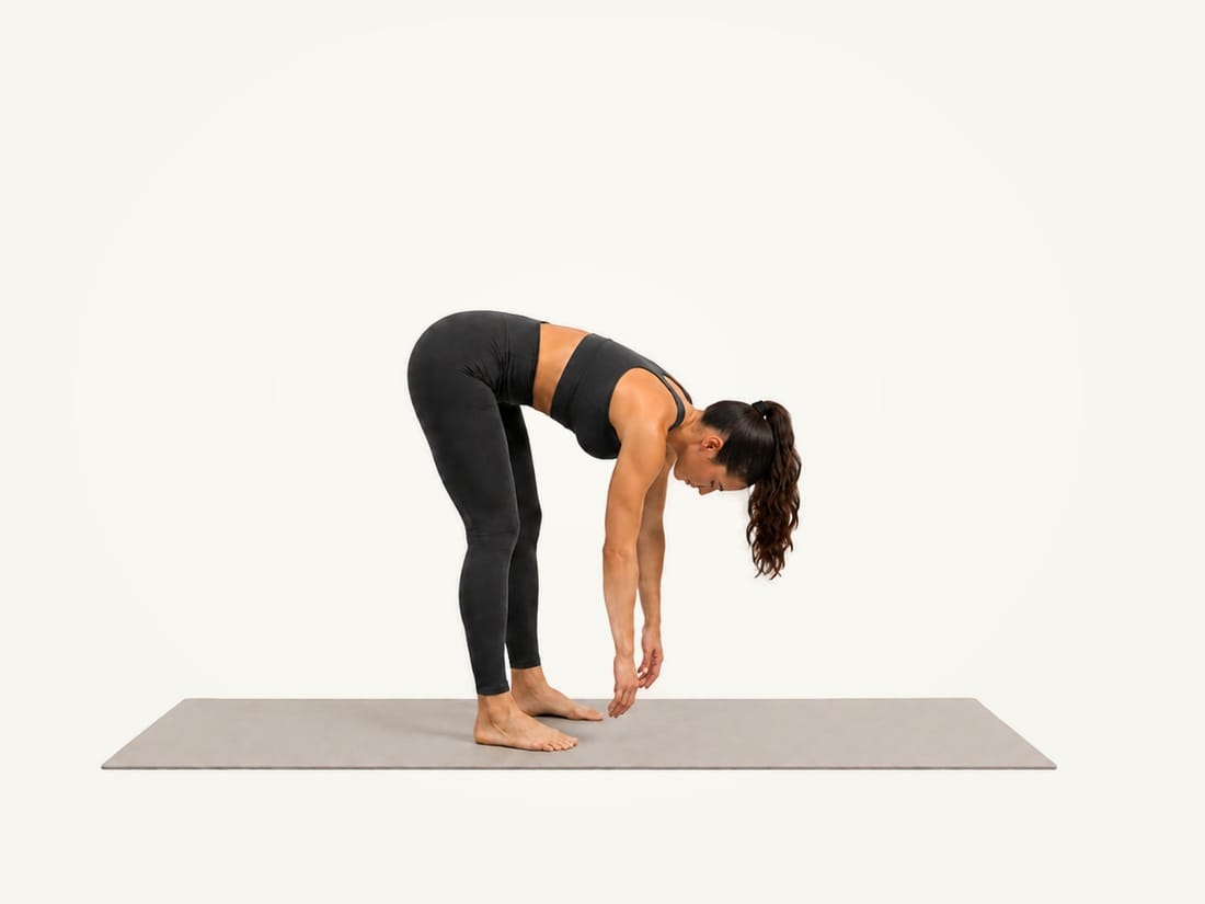Step 2 of the standing hamstring stretch: hinged forward from the hips with the arms hanging