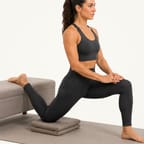 Couch stretch: back foot resting on a low bench, front foot planted, torso upright