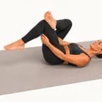 Figure 4 stretch: lying on the back with one ankle crossed over the other thigh