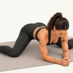 Frog stretch: on the forearms with knees wide apart and hips eased back