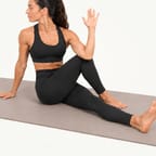 Seated spinal twist: sitting tall with one foot crossed outside the other knee, chest turned towards it